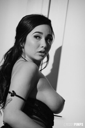 Black and white pictures of the girl with juicy melons masturbating hairy pussy