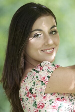 Photographer convinces the beautiful girl to take off floral dress outdoors