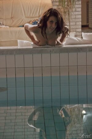 Before swimming the girl with tattooed back becomes horny and masturbates by pool