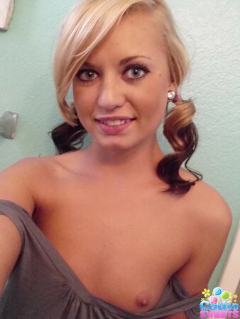 Playful babe makes erotic selfies showing off her naked body in the bathroom