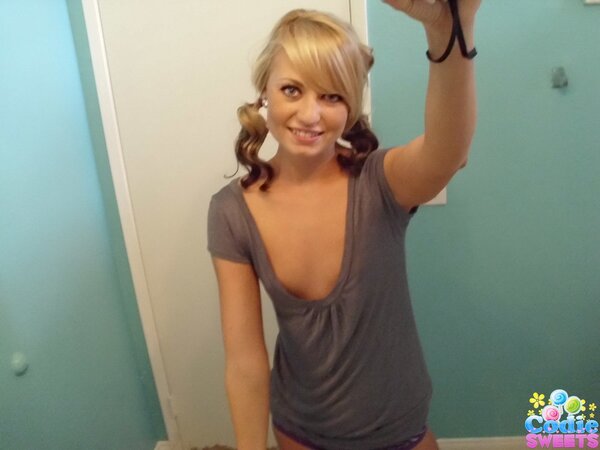 Playful babe makes erotic selfies showing off her naked body in the bathroom