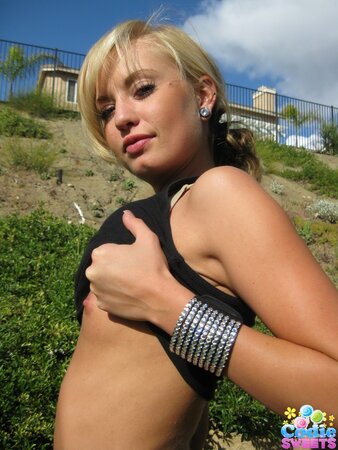 Fragile teen wench takes off clothes to show her small tits and cute ass outdoors