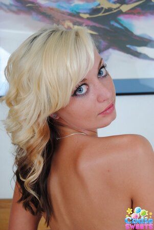 Cute blonde nympho gets rid of her lingerie and demonstrates smooth pussy