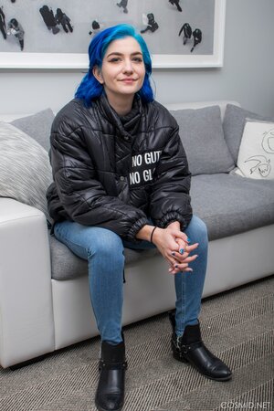 Goth girl with blue hair willingly strips revealing her nice boobs for the camera