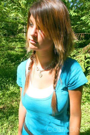 Slim hussy with sexy piercing shows her enormous tits on a sunny day outdoors