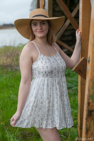 Hot country girl reveals her huge natural boobs and plump buttocks outdoors