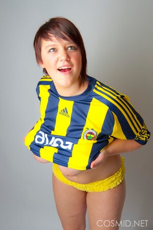 Chubby football fan pulls T-shirt off to show off her big tits and sexy panties