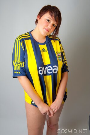 Chubby football fan pulls T-shirt off to show off her big tits and sexy panties