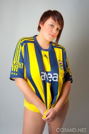 Chubby football fan pulls T-shirt off to show off her big tits and sexy panties