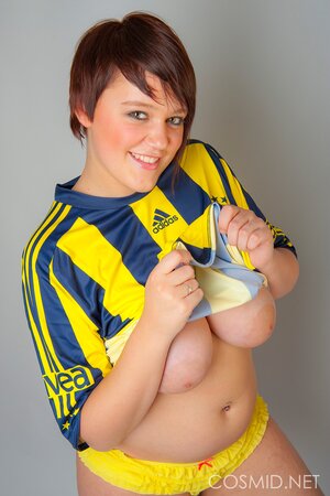 Chubby football fan pulls T-shirt off to show off her big tits and sexy panties