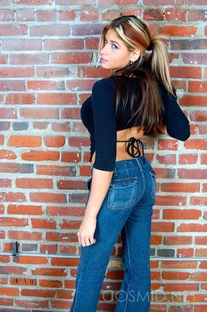 Sultry towheaded gal slowly strips to black lingerie to reveal her perfect curves