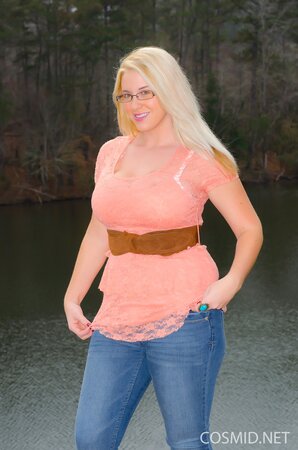 Erotic outdoor session of stunning blonde MILF showing big breasts at the lake