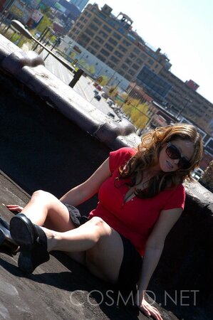 Busty whore in red top gets on the roof and teases with her big boobs