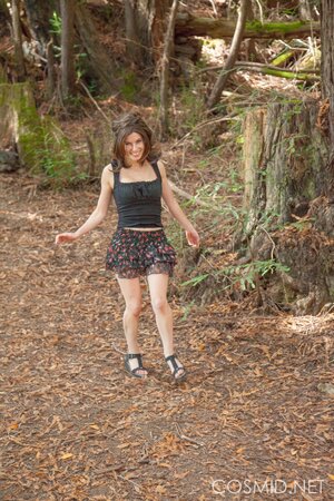 Slim country girl gets topless to reveal her fantastic big breasts in the woods