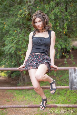 Slim country girl gets topless to reveal her fantastic big breasts in the woods