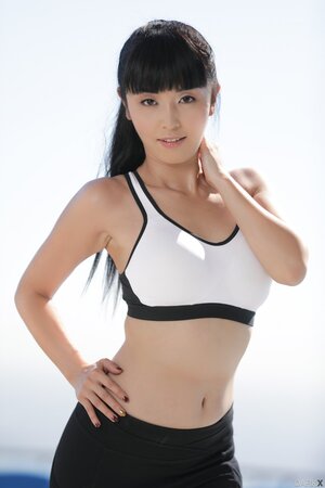 Petite Asian MILF strips off and teases with her fit naked body on the roof