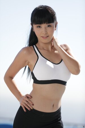 Petite Japanese MILF takes off leggings to show natural tits and bush on a rooftop
