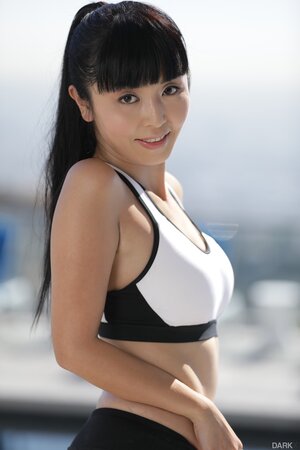 Petite Japanese MILF takes off leggings to show natural tits and bush on a rooftop