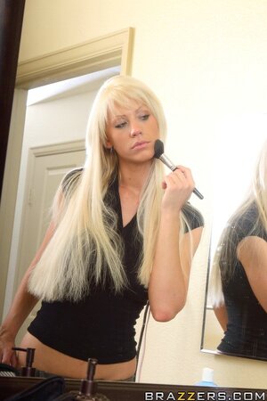 Blonde adult actress with big tits shows how she prepares for a day of work
