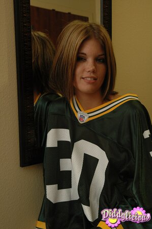 Football fan undresses and covers pussy using a piece of artificial cheese