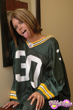 Football fan undresses and covers pussy using a piece of artificial cheese