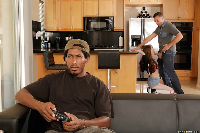 Bitch is sucking guest's cock while her boyfriend is playing a video game