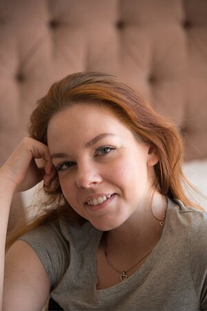 Red-haired cutie starts morning demonstrating naked body in the bedroom