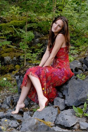Tall girl with long legs finds courage to strip naked while relaxing in the woods