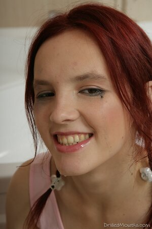 Lovely redhead facefucked and drilled in standing doggystyle in the bath