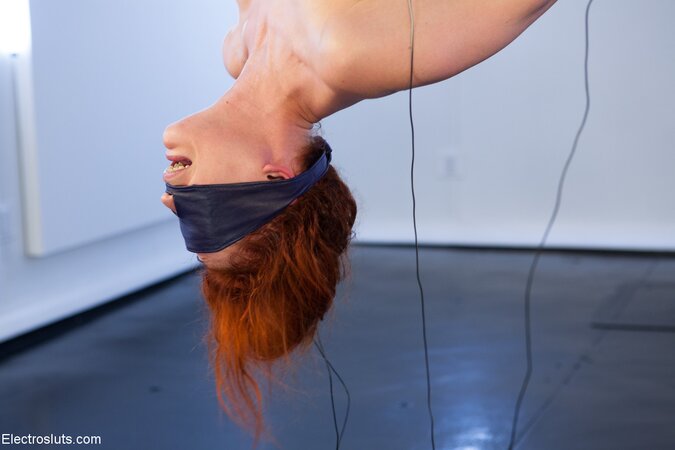 Blindfolded slut enjoys electric torture and licks her mistress' hairy cunt