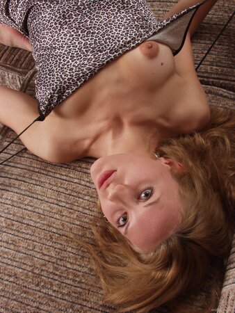 Naked model shows off her perfect body the best way when posing on the couch