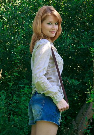 Slim ginger teeny demonstrates her natural curves on the wooden ladder
