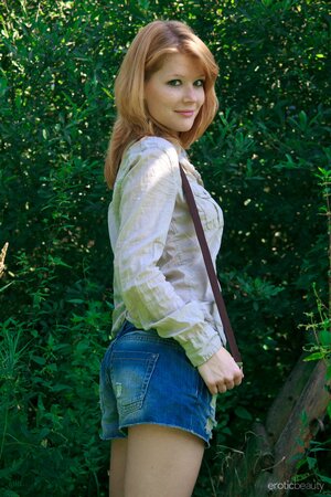 Slim ginger teeny demonstrates her natural curves on the wooden ladder
