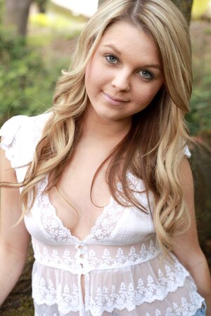 Sensual teen angel pulls off all clothes to show off her curves in the woods