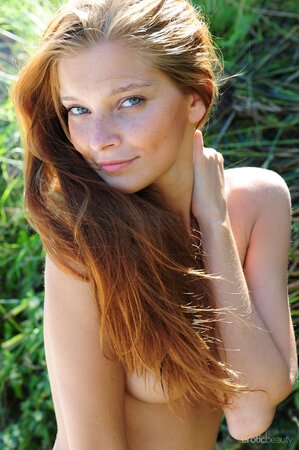 Young ginger stunner needs no clothes when she sees her boyfriend's camera
