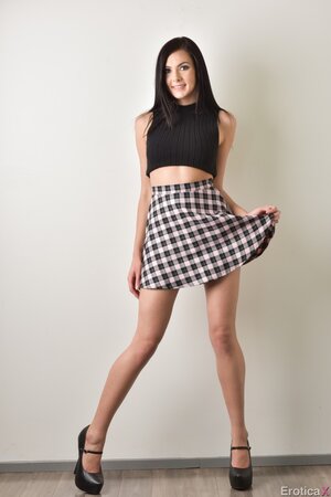 Attractive brunette hussy takes off clothes and demonstrates perfect body