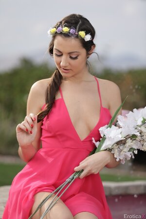 Erotic outdoor session of a dazzling young nympho taking off her pink dress