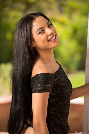Angelic Latina beauty removes her slinky dress and smiles as posing naked