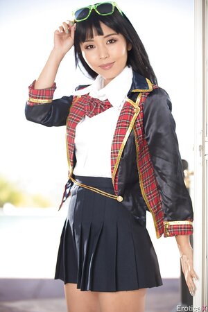 Sexy sweetie doffs sexy schoolgirl uniform to reveal her slim naked body