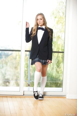 Cute porn newbie takes off school uniform to release her slim young body
