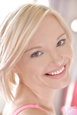 European blonde hottie stretches her teen pussy and sticks fingers into it