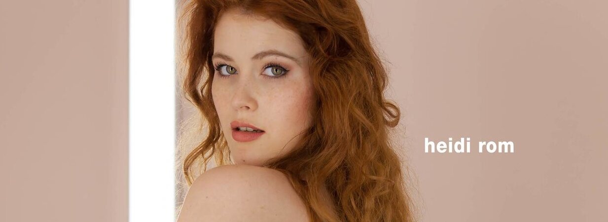 Horny redhead receives maximum pleasure while fingering her shaved pussy