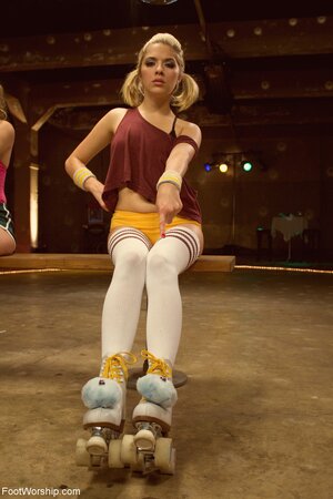 Cute young roller-skaters tease with their feet and want good worship