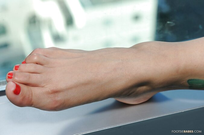 Shy Thai girl in heels is modelling to expose her sexy feet and peach