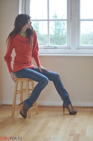 Sensitive brunette girl enjoys herself while revealing underwear by the window