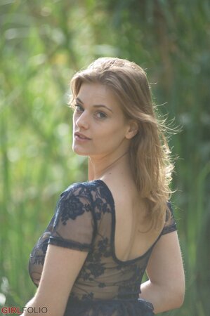 Sensual blonde is brave enough to have a stroll in light transparent dress
