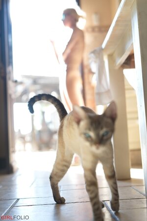 Fit blonde chick is not afraid to pose nude while doing everyday business