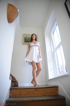 Playful sexpot looks extremely hot while striping and revealing naked body