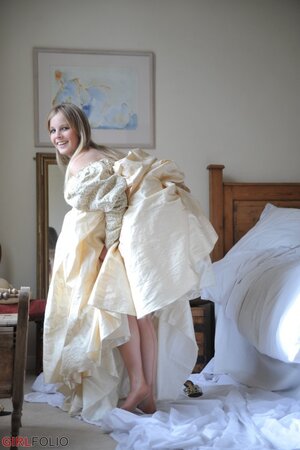 Gorgeous blonde discards vintage dress till she is left in corset and stockings