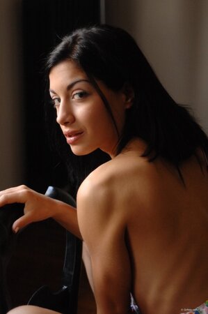 Luscious black-haired honey doffs dress to show every inch of her young body